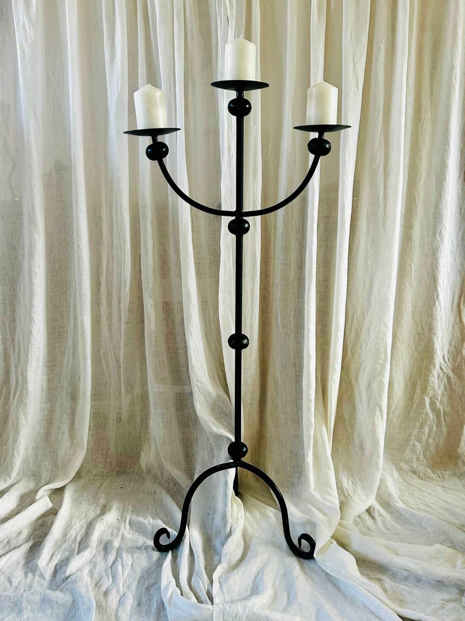 Vintage wrought iron floor candelabra with three candle holders