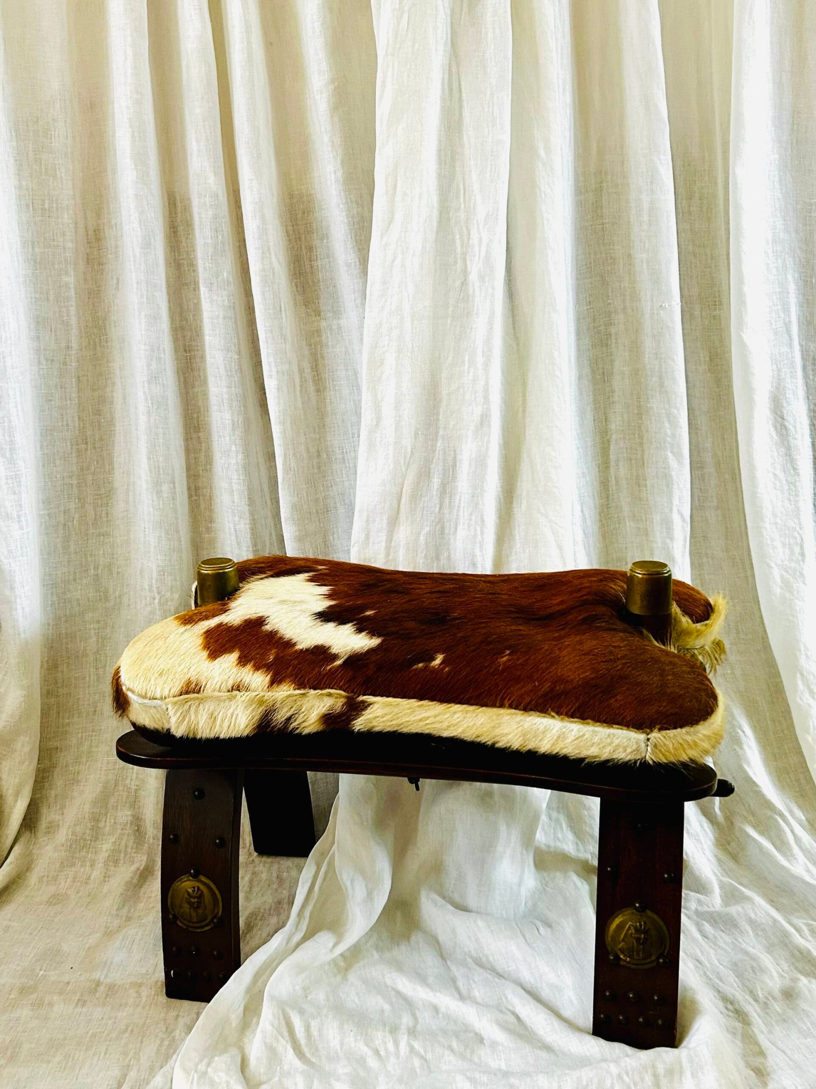 Vintage Moroccan camel saddle stool with cowhide upholstery ๐.